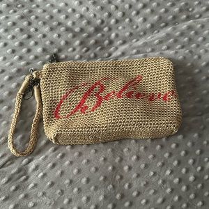 The sak crochet nude “believe” wristlet pouch